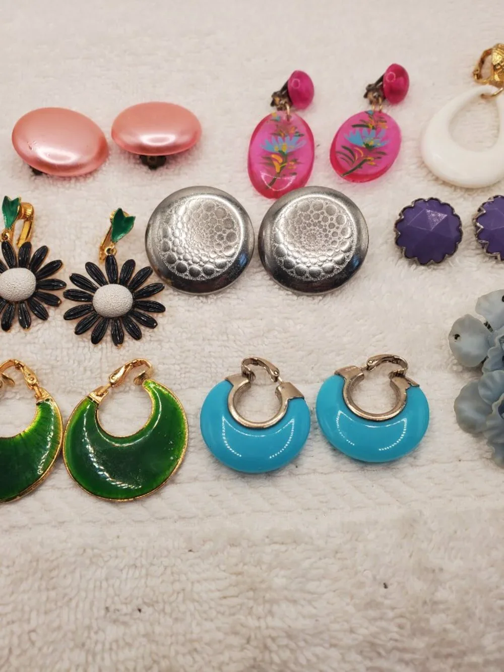 12 Pair of clip on earrings, items # B-2106-2117,.  wt. 123 grams.